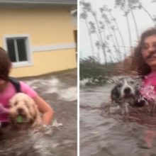 Jovem não solta de jeito nenhum seus dois cães no meio de um furacão